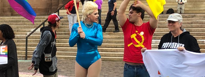 Progressives Protest Catholic Church in Providence Progressive wearing communist hammer and sickle alongside drag queen protests on Catholic holy ground.